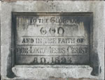 The original foundation stone reading 'To the glory of God and in the faith of our Lord Jesus Christ'